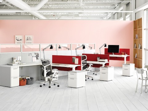 Mirra 2 ergonomic office chairs in an open office with Action Office workstations and Renew sit-to-stand desks. 