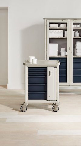 Two supply carts with a single-wide shorter cart in the front and a double-wide tall cart in the back.