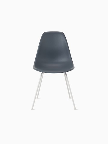 Light tan Eames Molded Plastic side chair with a wire base, viewed from the side.