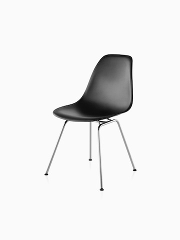 Four-leg version of a black Eames Molded Plastic side chair, viewed from a 45-degree angle.