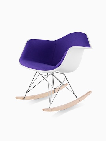 Purple upholstered Eames Molded Plastic rocking chair, viewed from a 45-degree angle.