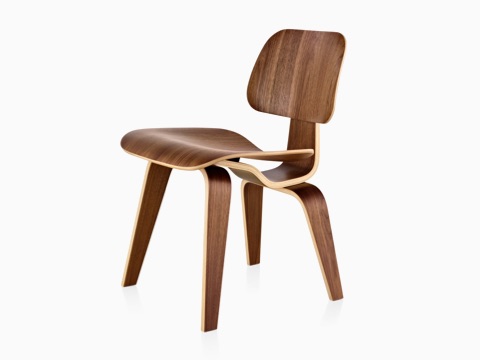 Eames Molded Plywood Chair with a medium finish and wood legs, viewed from a 45-degree angle.