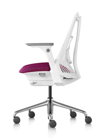 Profile view of white Sayl office chair, showing suspension back with PostureFit support and magenta upholstered seat.