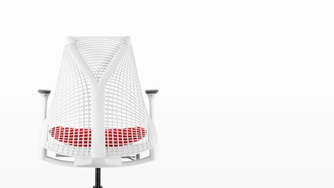 White Sayl office chair with suspension back and red upholstered seat, viewed from behind.