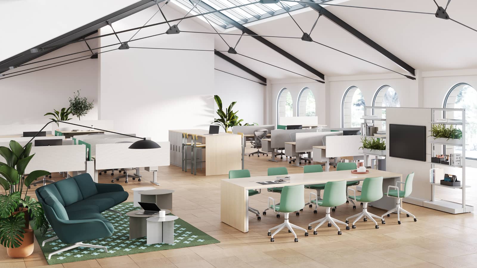 A workplace neighborhood designed for a team that balances independent work with interdependent decision-making, featuring comfortable furnishings that promote a collegial atmosphere.