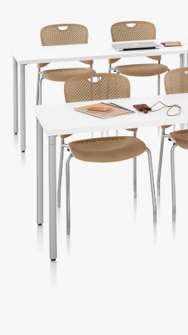 White Everywhere Tables with brown Caper Stacking Chairs. Select to go to the tables landing page. 