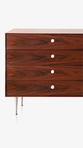 A four-drawer chest from the Nelson Thin Edge Group. Select to see storage items available from the Herman Miller Store.