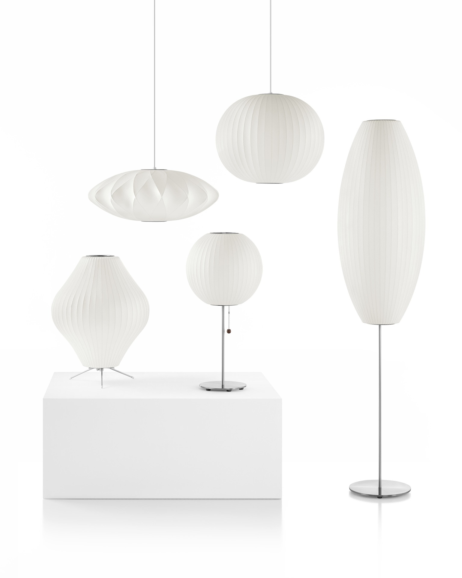 A family shot of Nelson Bubble Lamps, including two pendants, a table, a tripod, and a floor lamp.