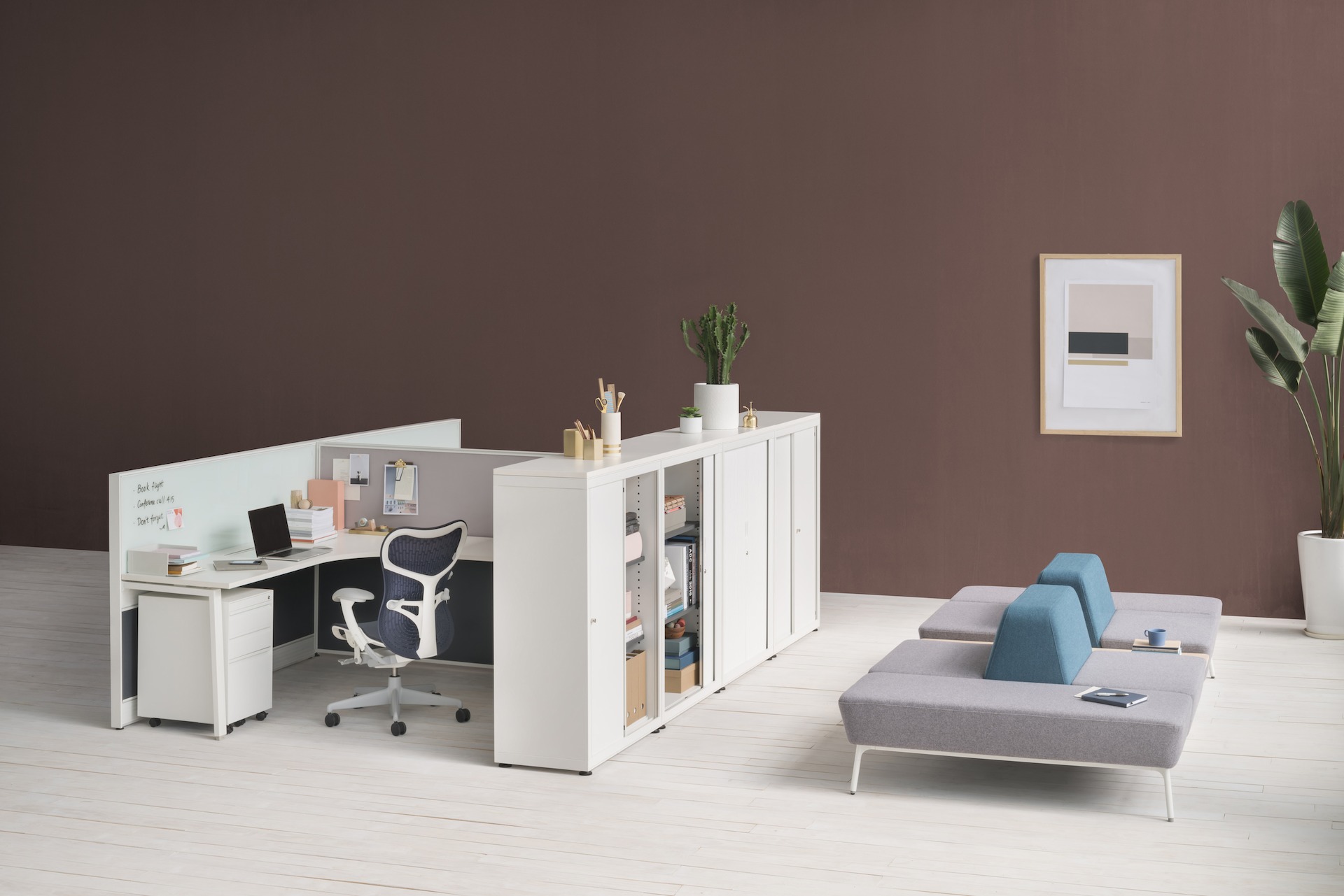 A four-piece mid-height CK Storage sits behind two L-shaped Imagine Desking workstations.