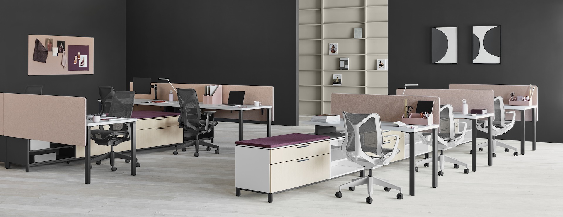 Two Canvas Storage workstations with pink screens, lower storage with purple cushion tops, and Cosm chairs .
