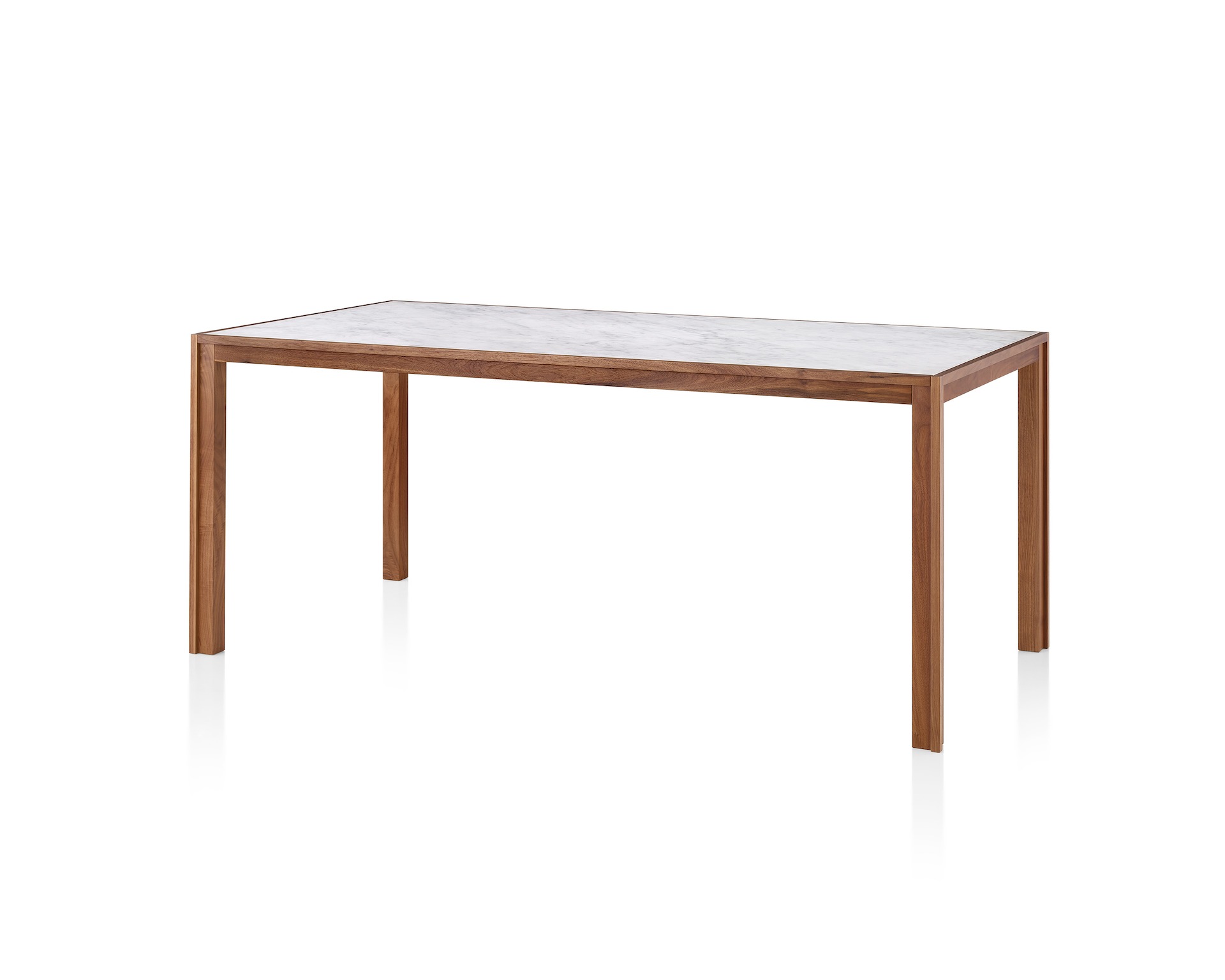 A walnut Doubleframe Table featuring a Carrara mable top, viewed from an angle.