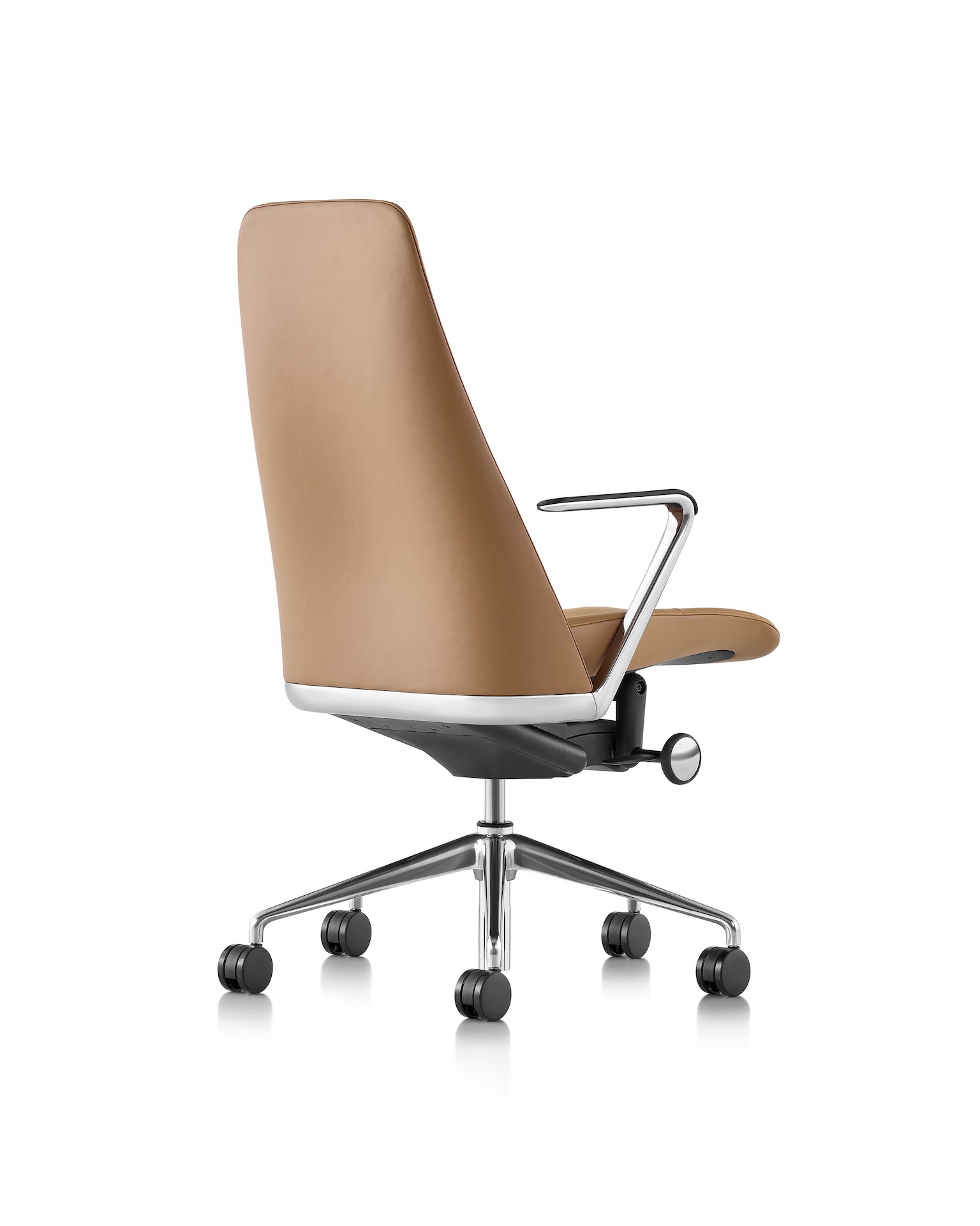 A Taper Chair featuring a camel colored leather and a polished aluminum base.