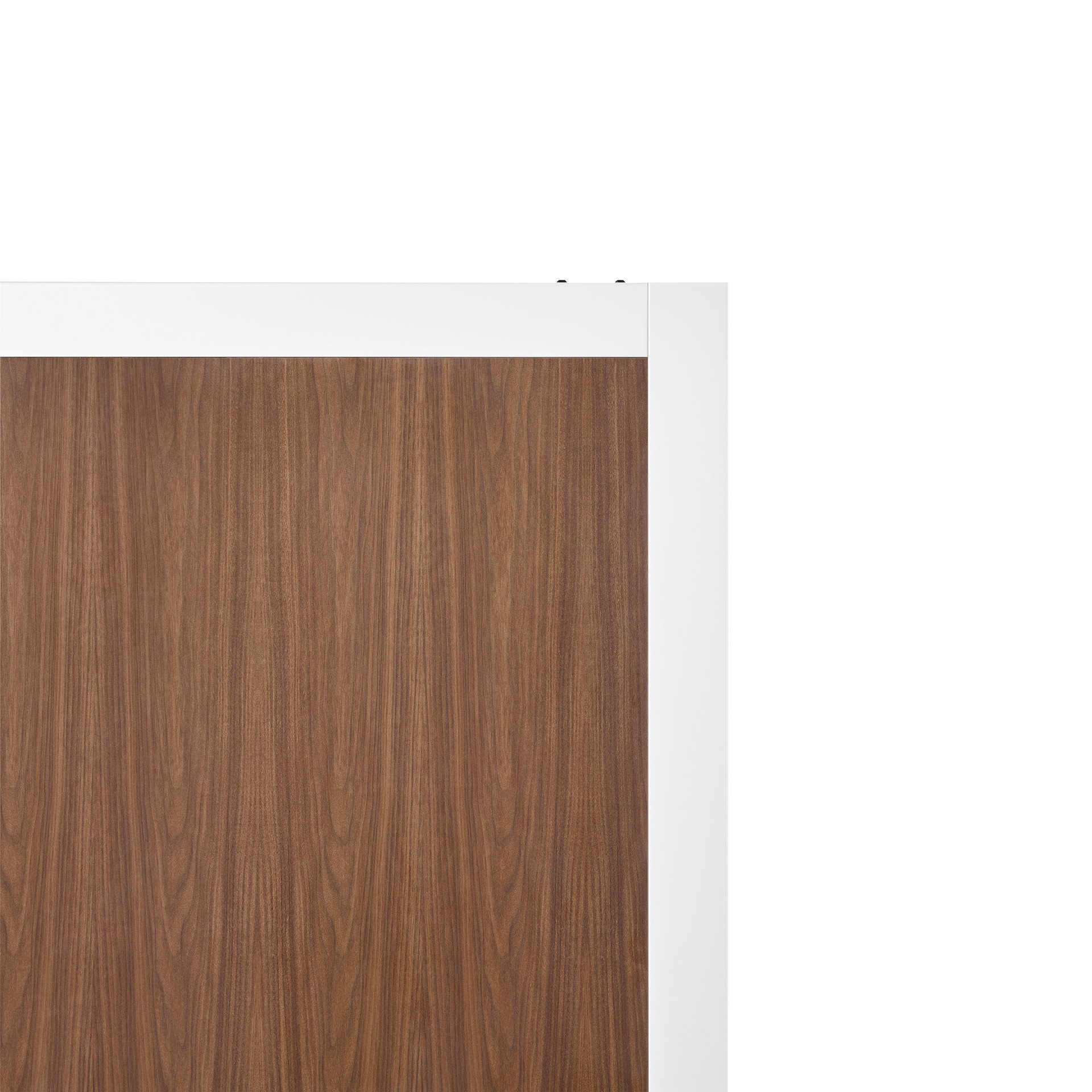 A close-up of walnut woodgrain laminate on Overlay's white structure.