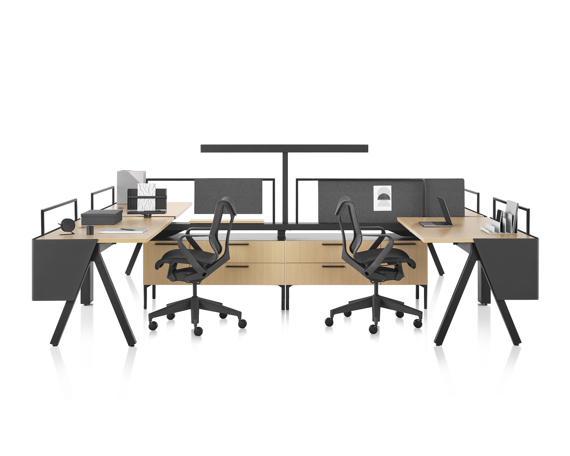 Brown and black Canvas Vista workstations with a-shaped legs, modesty screens, t-shaped light and black Cosm chairs. 