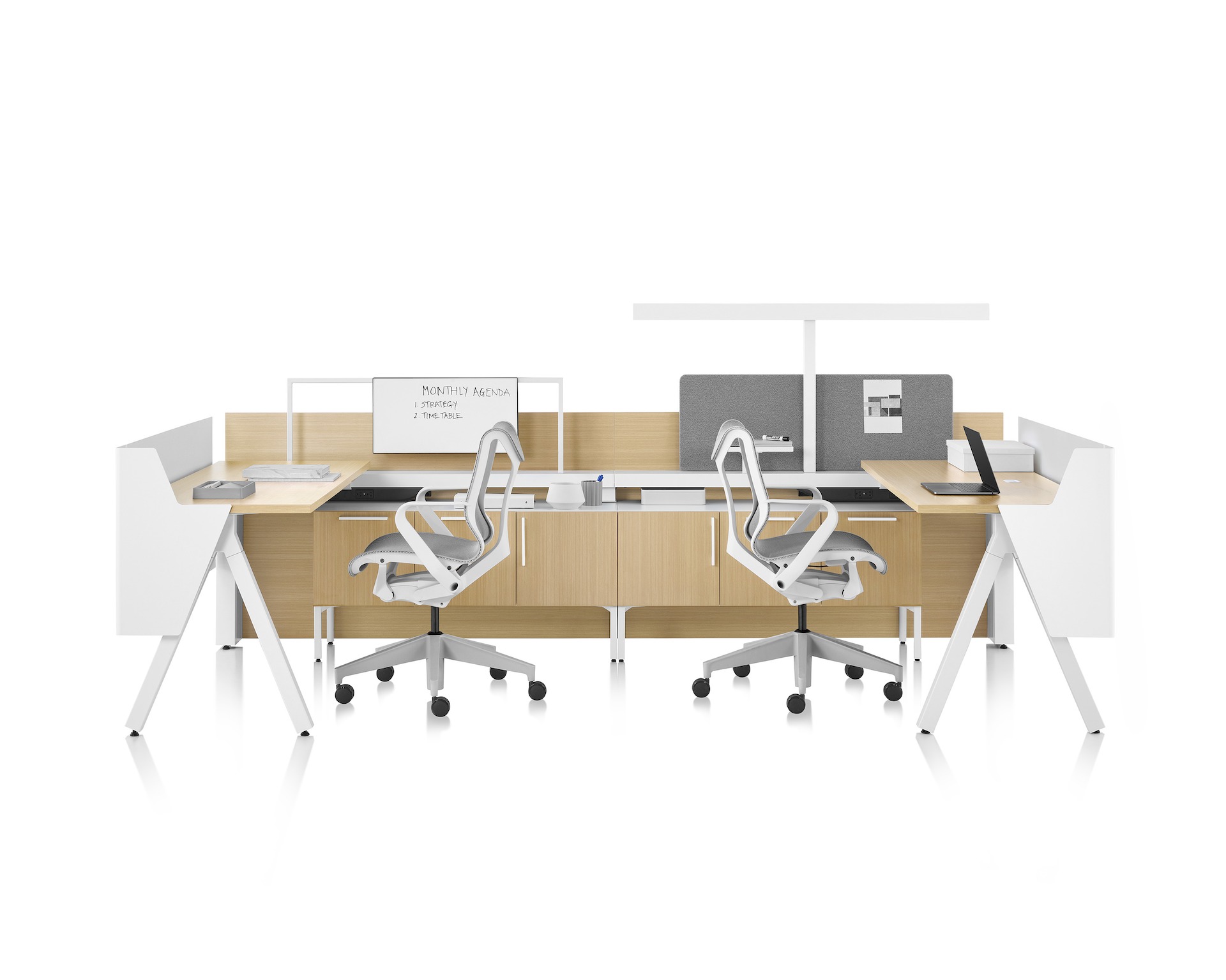 Brown and white Canvas Vista workstations with a-shaped legs, modesty and privacy screens, t-shaped light, gray boundary screens, and Cosm chairs.