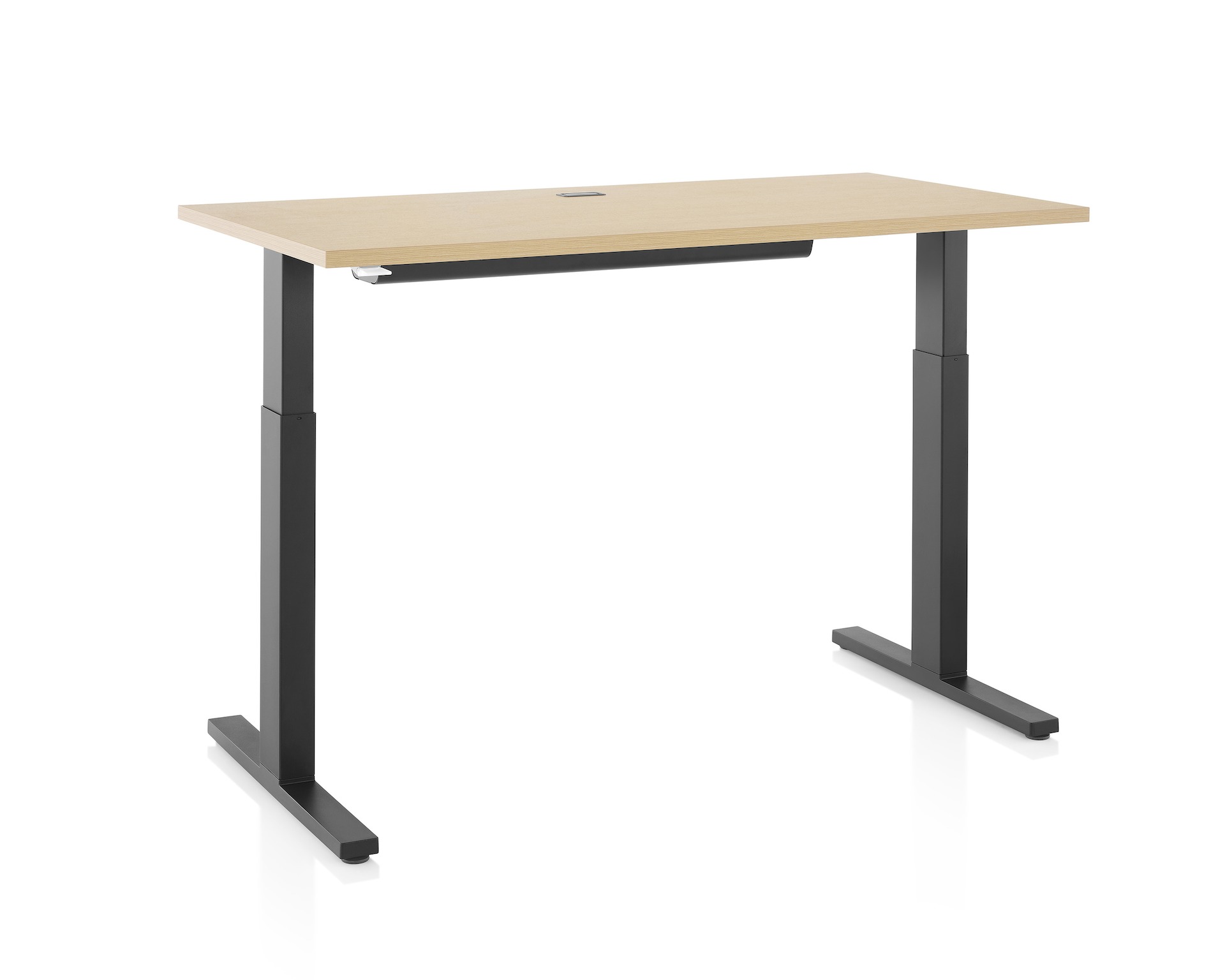 Brown and black Motia sit-to-stand table with cable trough, viewed at an angle. 