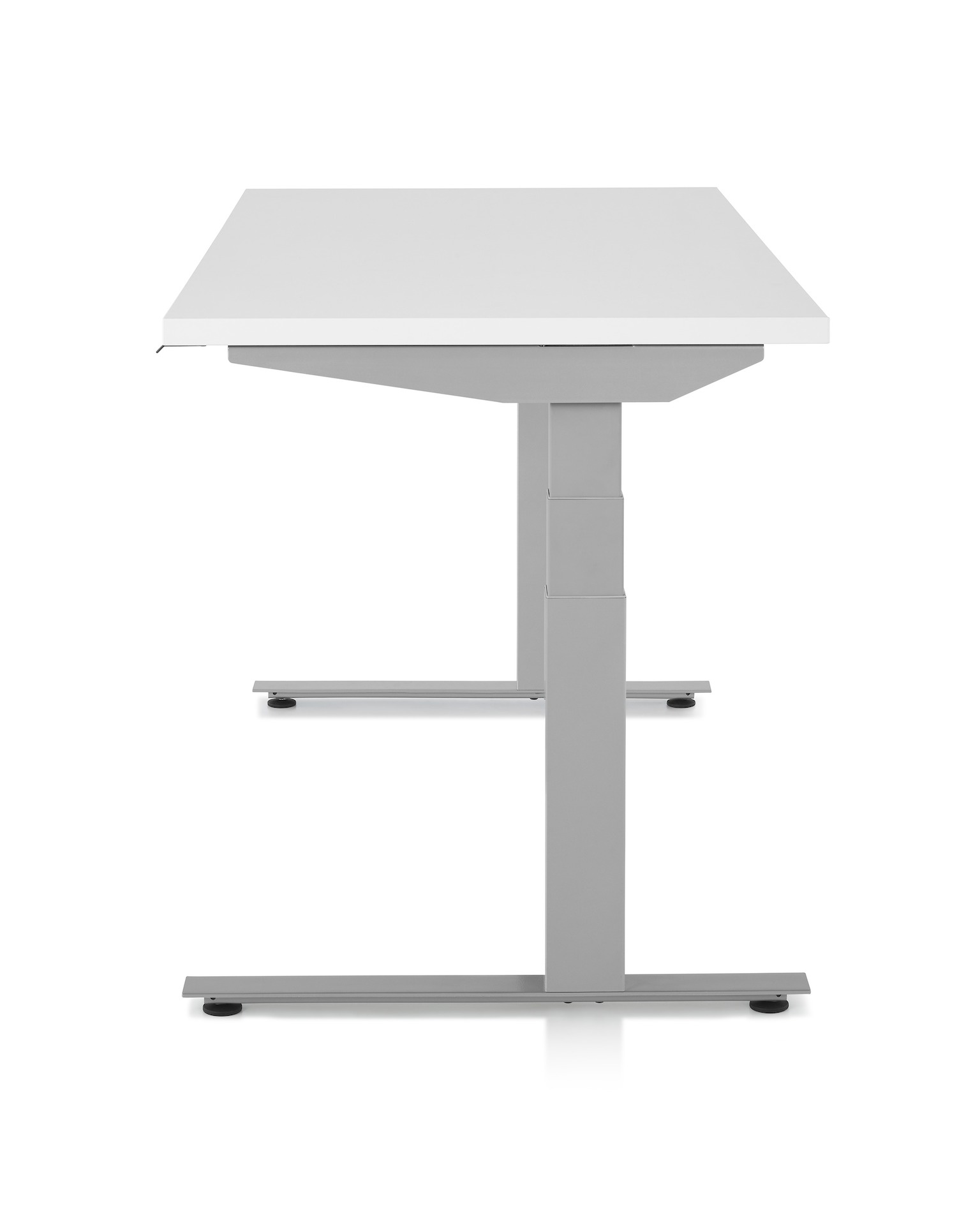 Side profile view of standing desk, Nevi Sit-to-Stand Tables, with a white work surface and metallic silver legs.