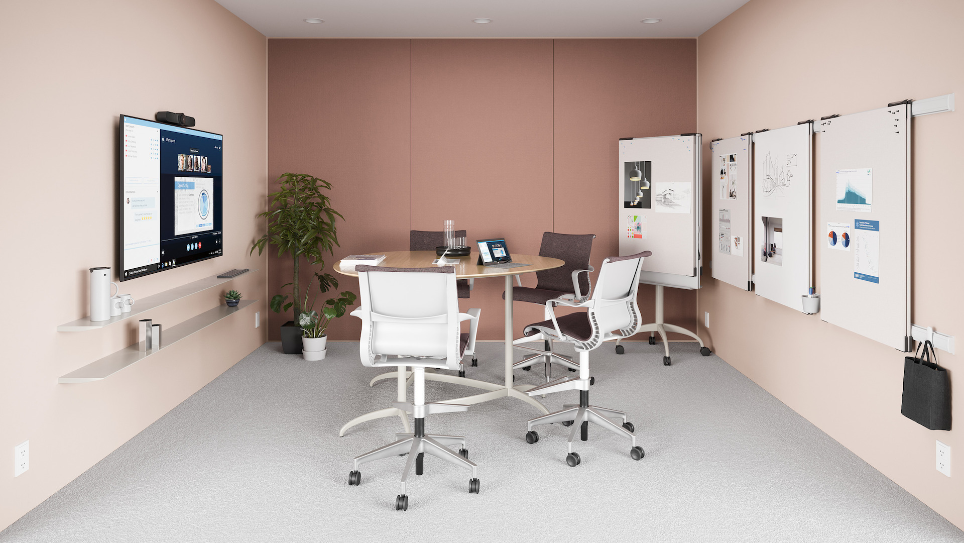 A light pink meeting space with a small table and Setu Stools, featuring the Avacor technology from Logitech.