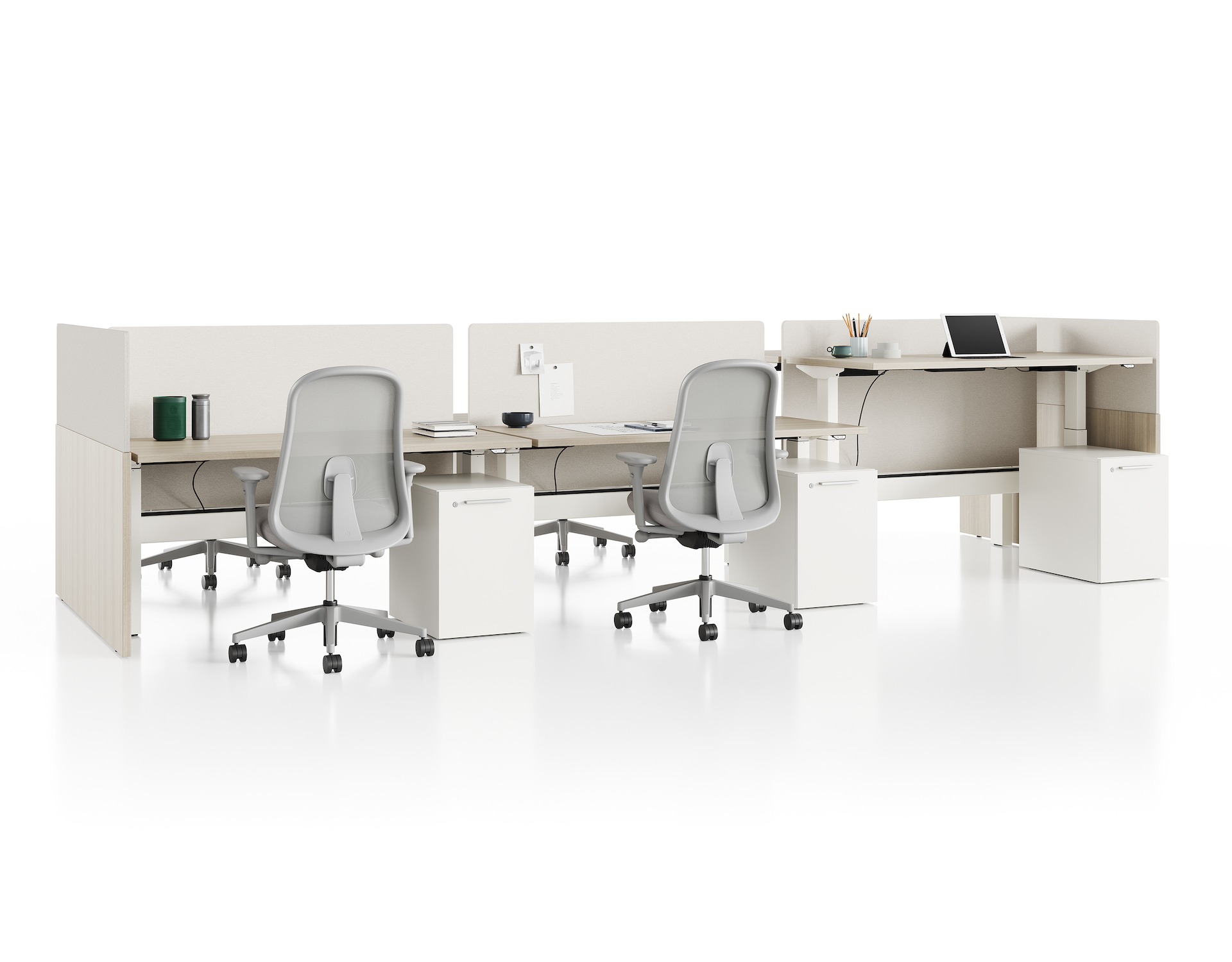 Standing desk system, Nevi Link, with rectangular work surfaces, privacy screens, and Lino Chairs. Two of six desks are raised to standing height.