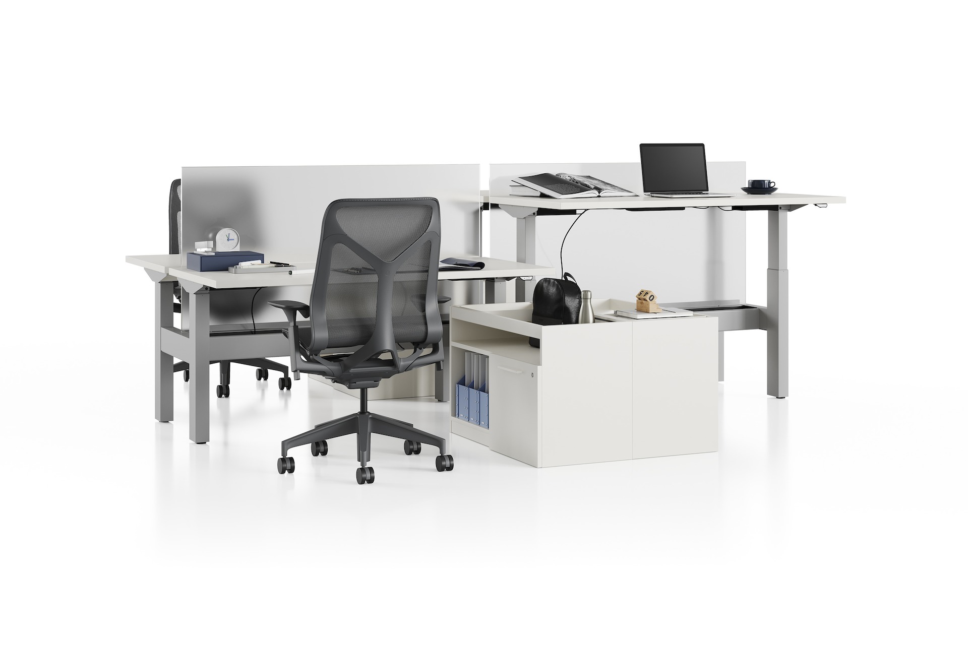 Standing desk system, Nevi Link, with rectangular work surfaces, privacy screens and Cosm chairs. Two of four desks are raised to standing height.