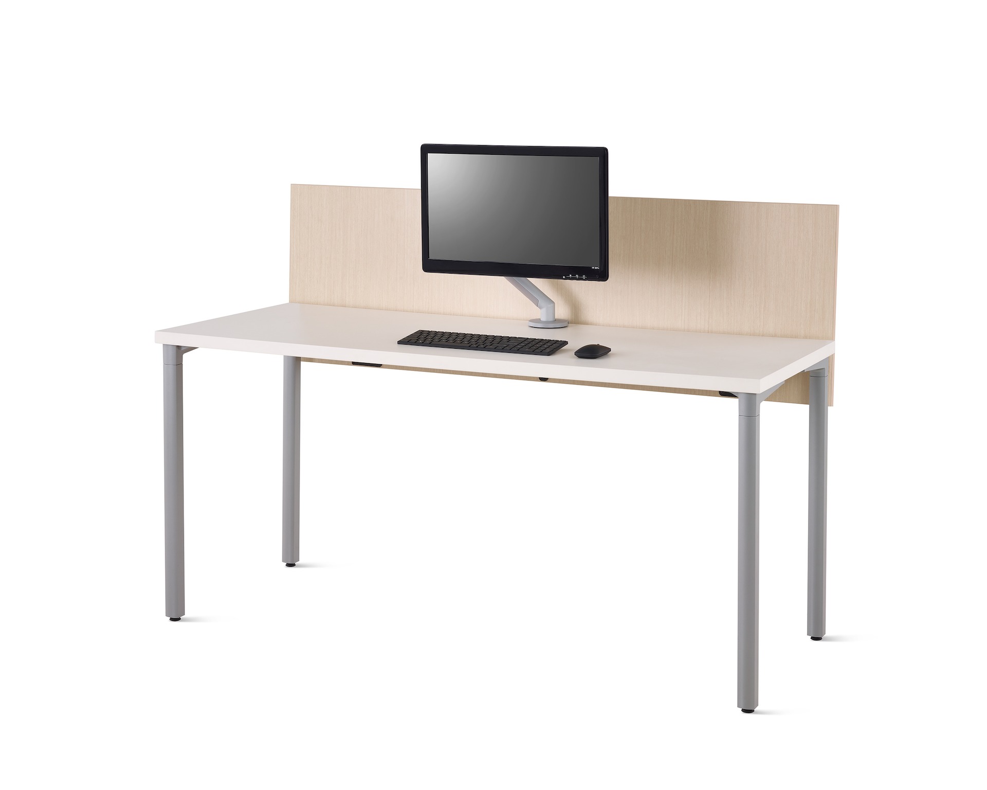 Viewed at an angle, a white Everywhere desk with an ash woodgrain laminate privacy screen, gray legs and silver Flo Monitor Arm.