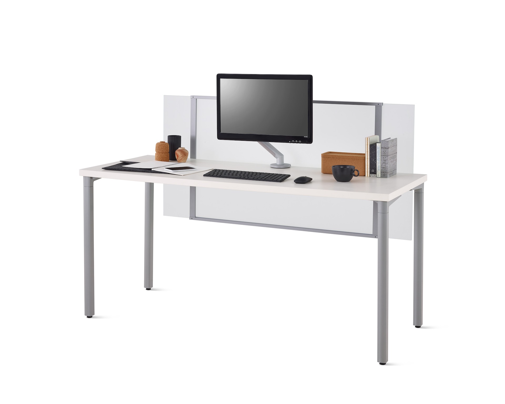 Viewed at an angle, a white Everywhere desk with a frosted glass surface-attached privacy screen, gray legs, and Flo monitor arm.