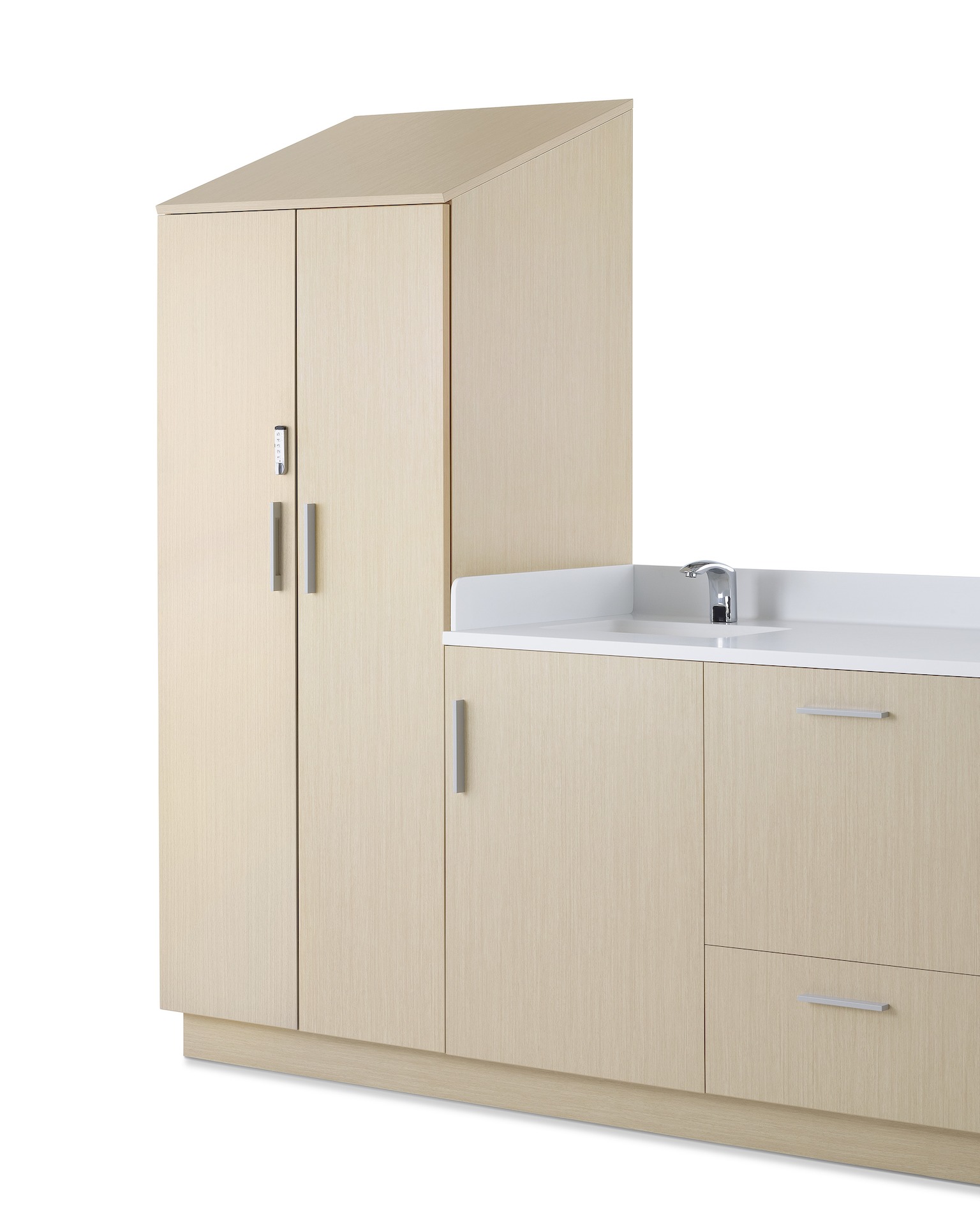 Mora System in a light wood finish, to-the-floor configuration with sink and white Corian surface.