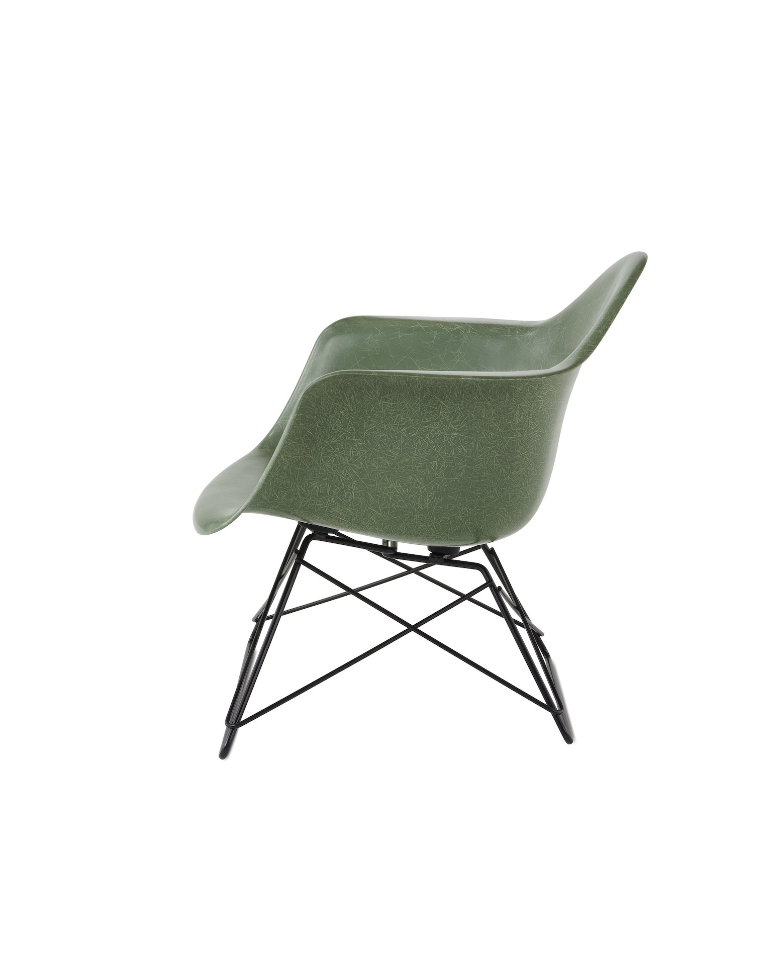 An Eames Molded Fiberglass Armchair with a low wire base, viewed from the side.