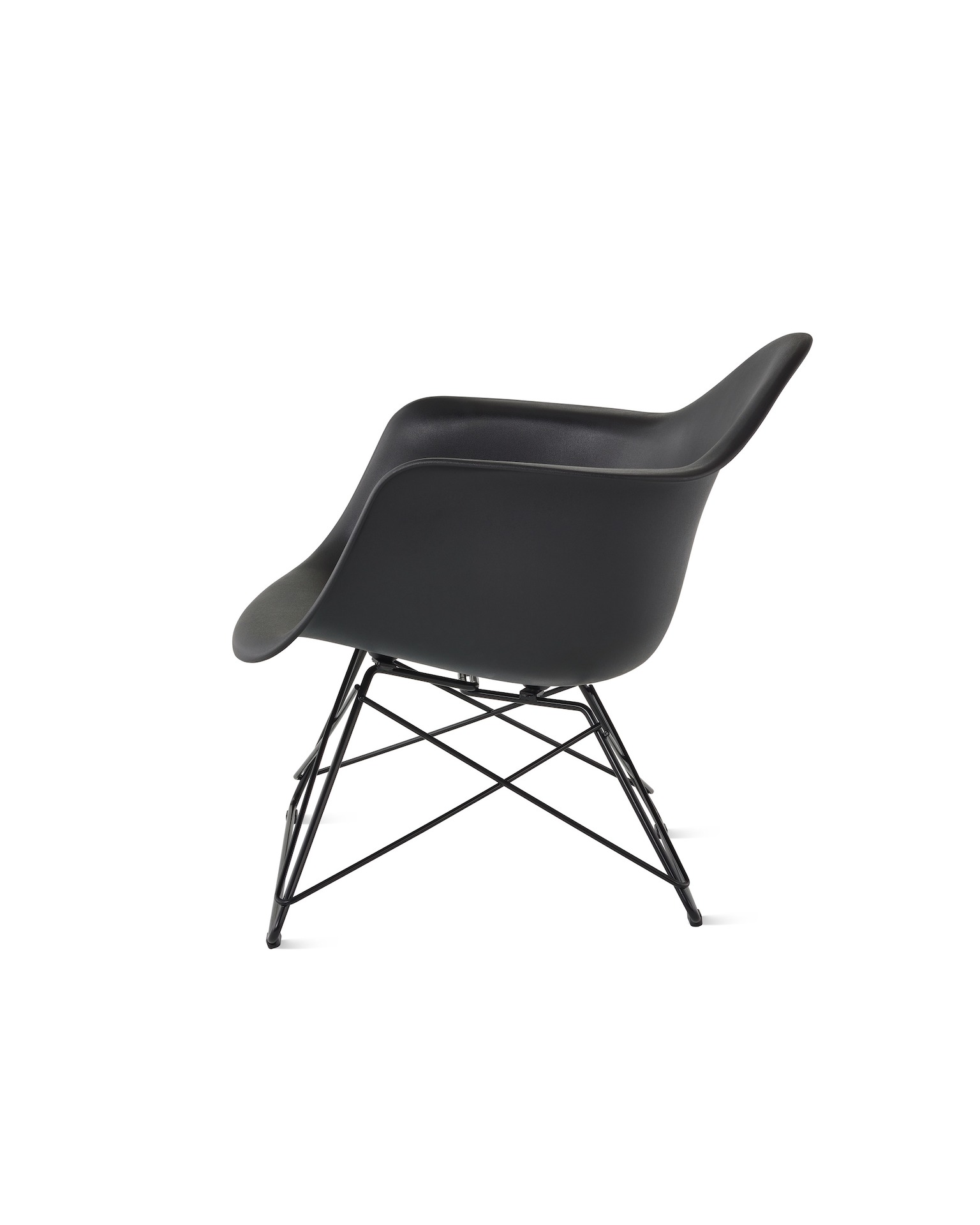 An Eames Molded Plastic Armchair with a low wire base, viewed from the side.