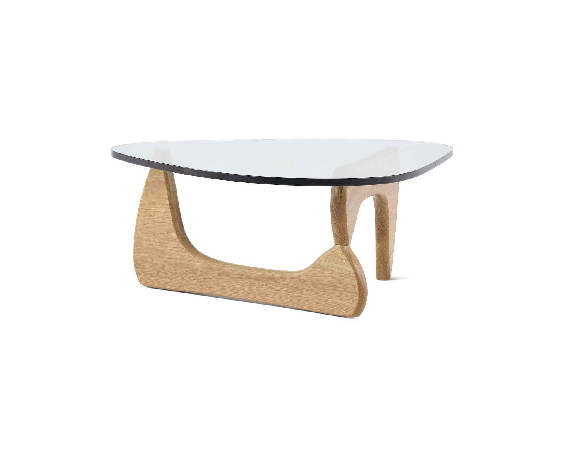 A Noguchi Table with light wood base and glass top.