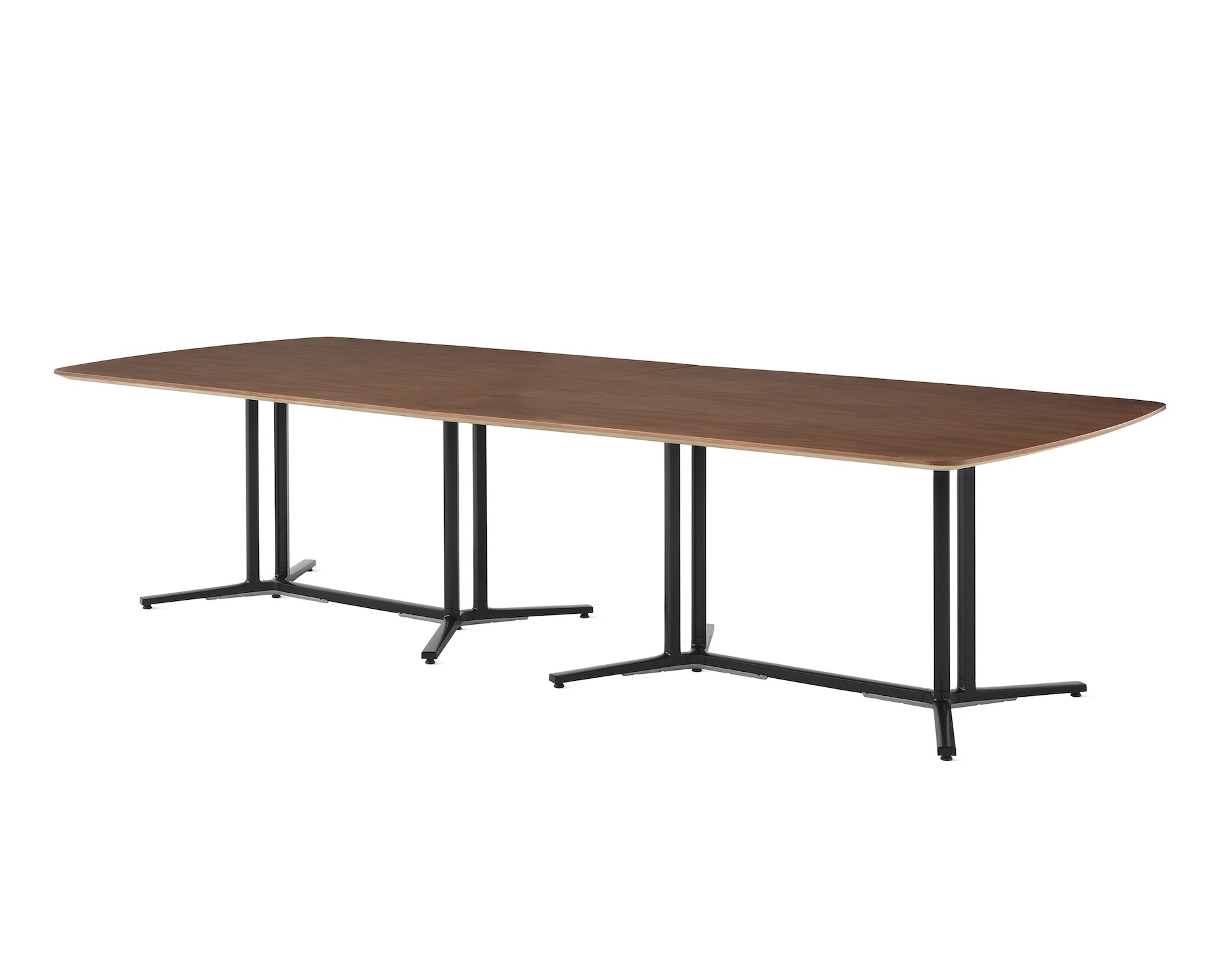A Everywhere conference table with a walnut top and black legs. 