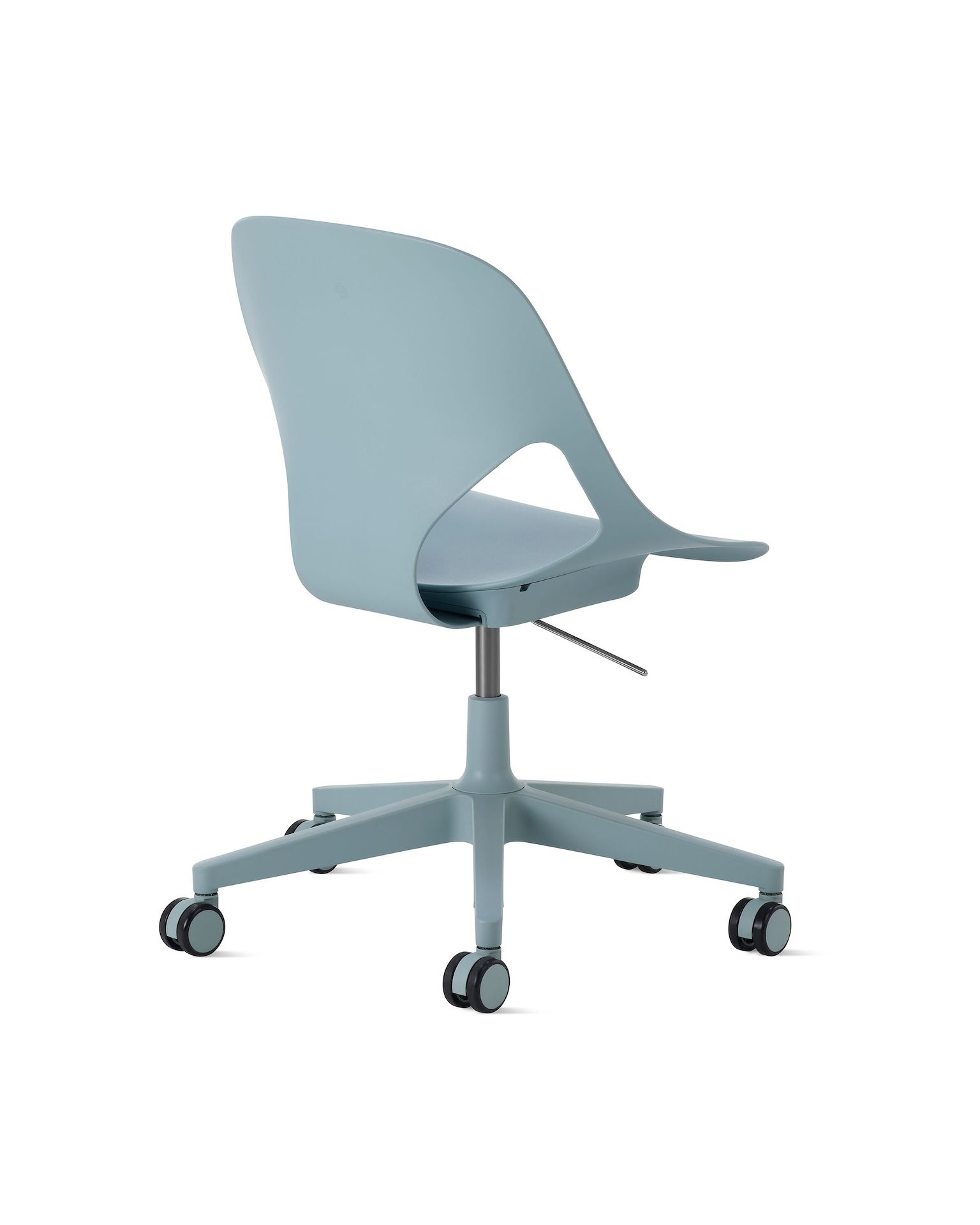 Rear angle view of a light blue armless Zeph chair.