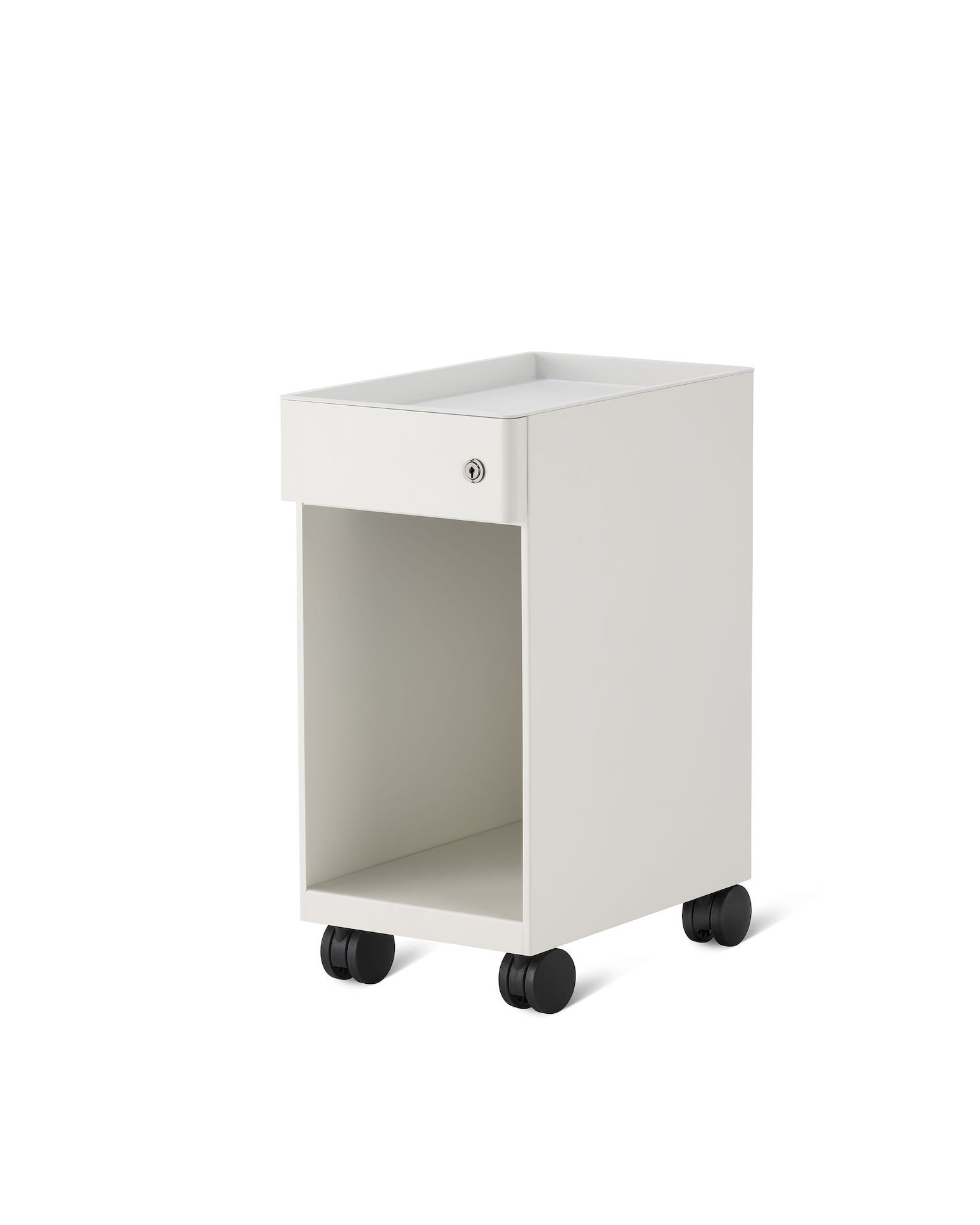 Slim, white storage pedestal on casters with a drawer and a lock, an open tray on top, and opening below drawer for storage.