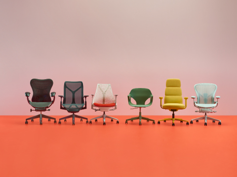 A colorful line up of Herman Miller office chairs including Mirra 2, Sayl, Cosm, Asari, Zeph and Aeron on a pink/orange background