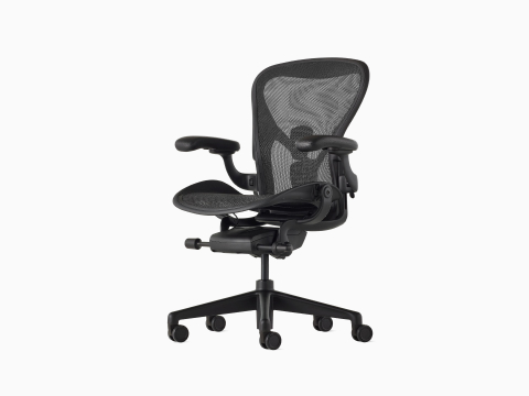 Black Aeron Chair on a white background with a 5-star base and ergonomic back support, viewed at an angle.