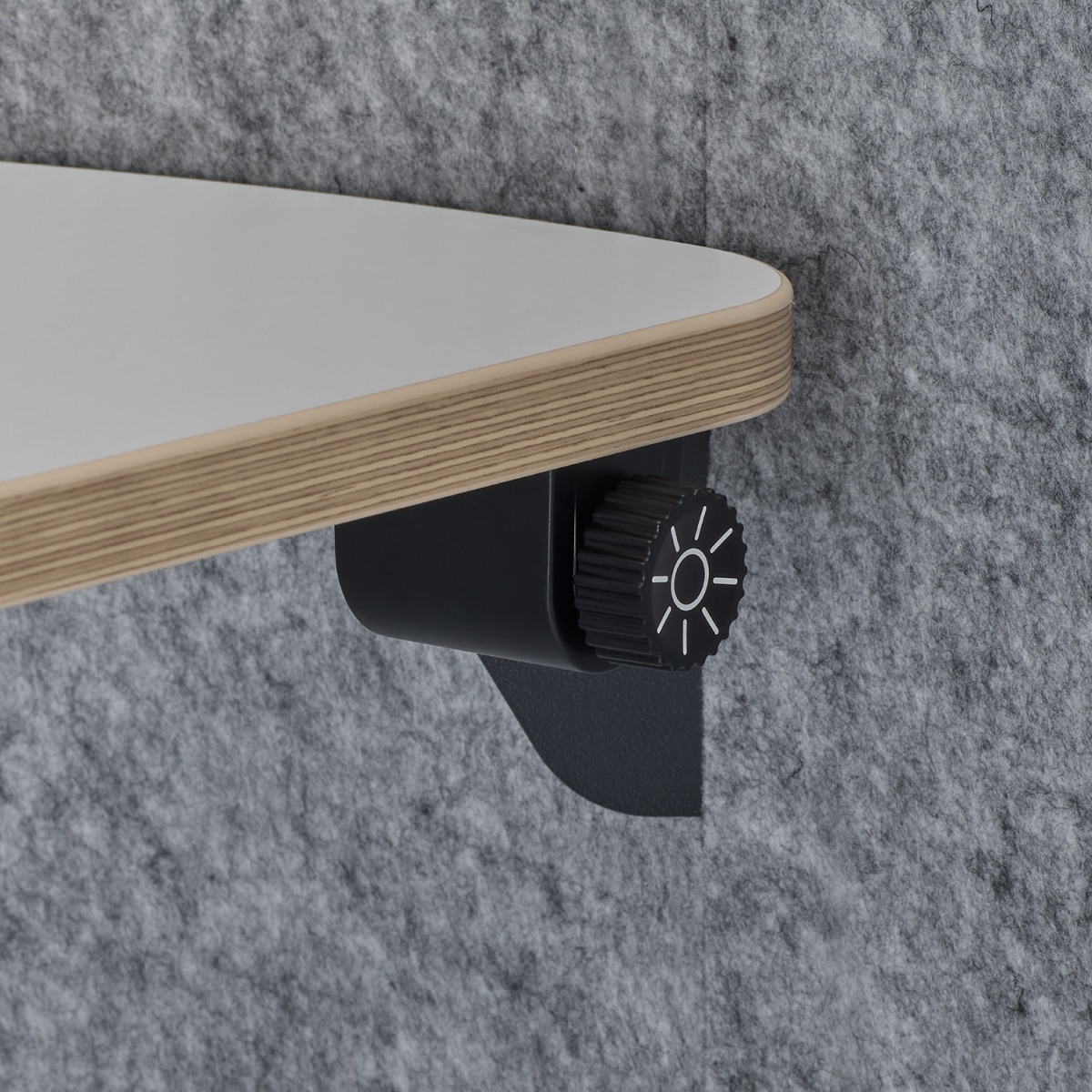 A detail view of the lighitng dimmer inside a Bay Work Pod, paired with a plywood edge detail on the worksurface.