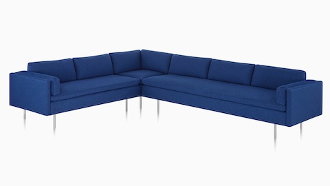 Canapé Bolster Sofa Group bleu, avec fauteuils d’angle, vu de face.