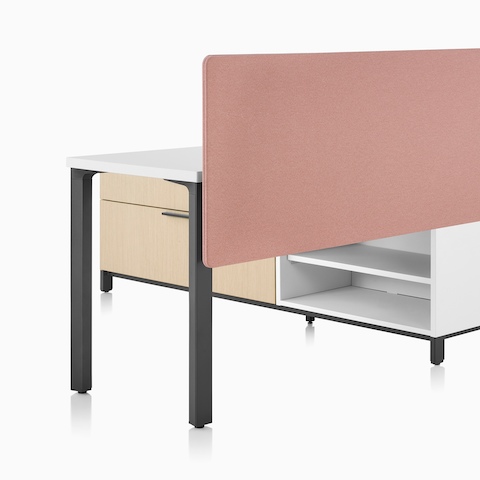 A Canvas Storage workstation in light wood with a white surface, pink screen, and graphite legs.