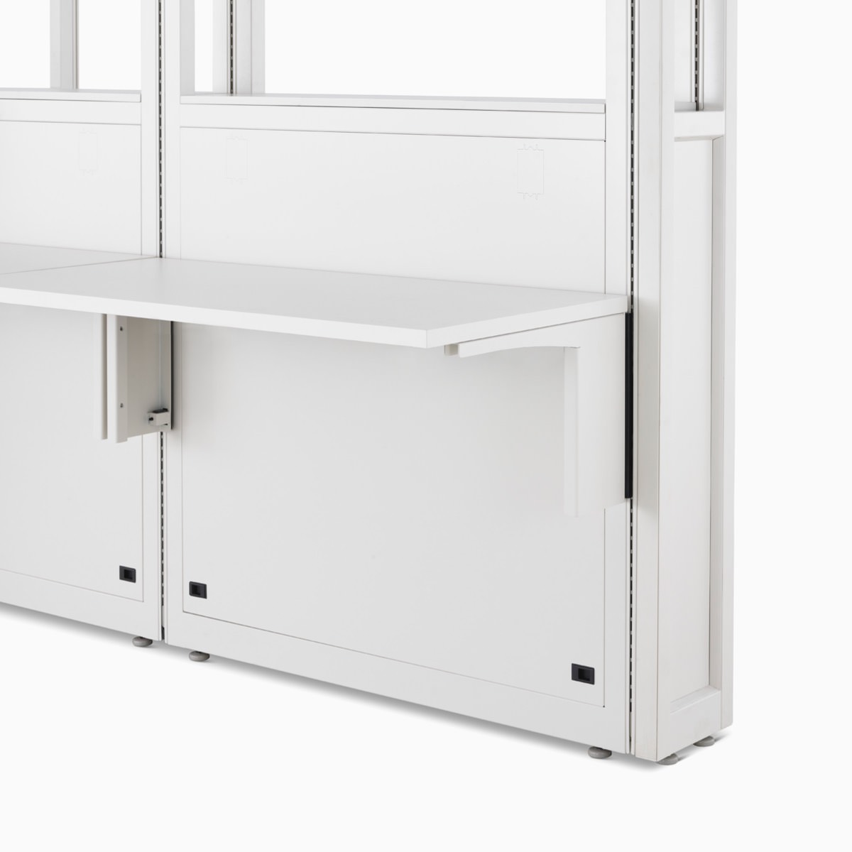 Detail of Co/Struc System module with work surfaces in soft white.