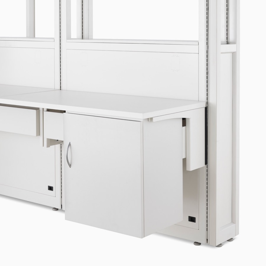 Detail of soft white Co/Struc System frame module, work surface, and storage unit hanging on an adapter rail under the surface.