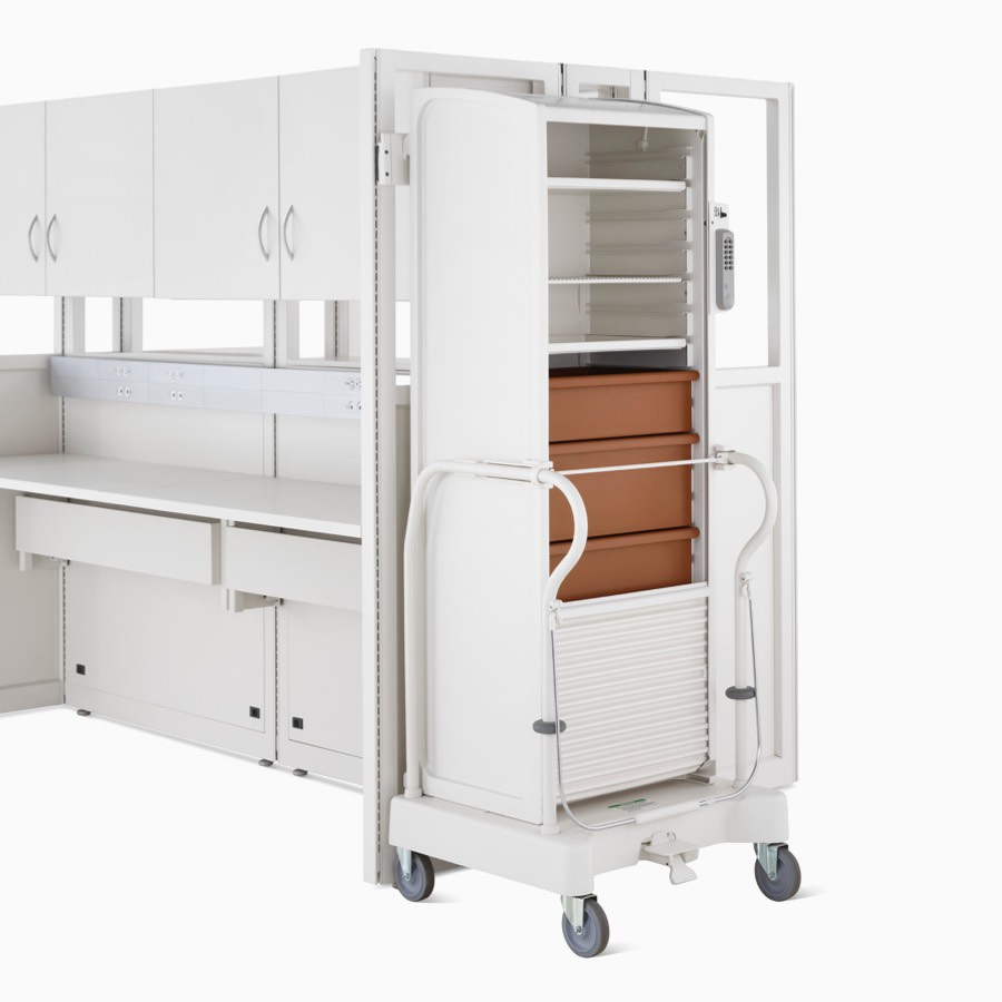 Detail of soft white Co/Struc System locker with terra cotta drawers on a TR3 transport cart.