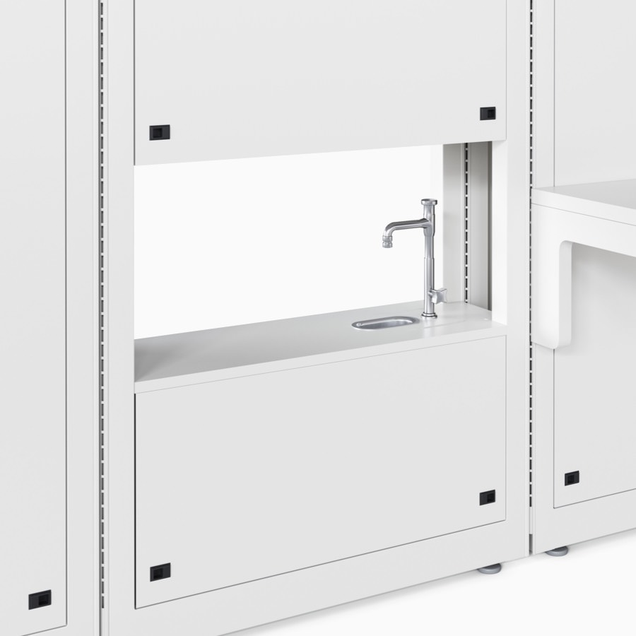 Co/Struc lab module in a soft white finish with an opening in the module that contains a cup sink and faucet.
