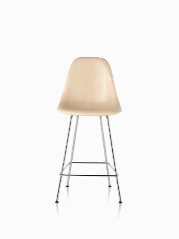 Eames Molded Wood Stool with a light finish and silver legs, viewed from the front. 