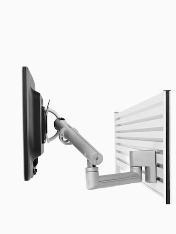 Un brazo de monitor Flo ajustable diseñado para sistemas de riel montados en panel.