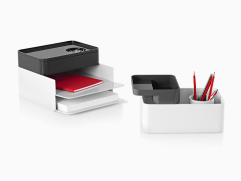 Two configurations of Formwork stackable desktop storage items, including paper trays, large and small boxes, and a pencil cup.