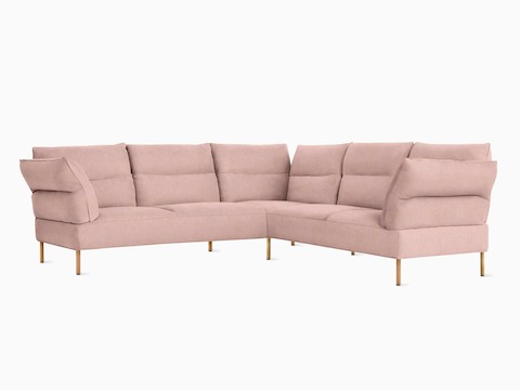 A front angled view of the Pandarine Sectional in light pink.