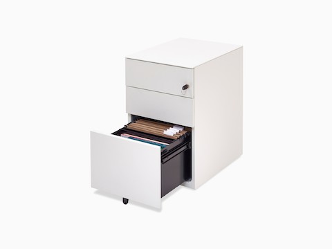 Angled view of white Kumi pedestal with opened file drawer showing folders.