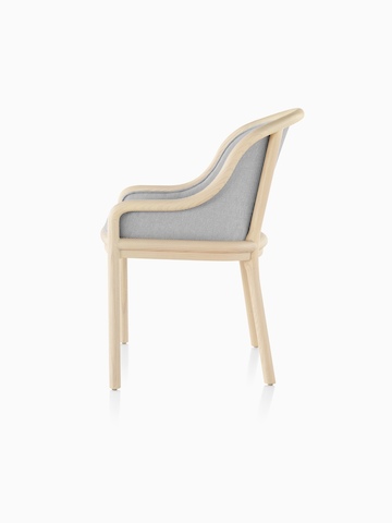Landmark Chair with light gray upholstery and a light wood frame, viewed from the side.