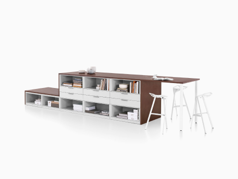 Dark brown and white Meridian Storage lateral file and bookshelf configuration with collaborative surface and three white Magis Stool One stools.