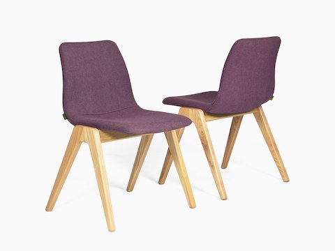 Two purple NaughtOne Viv Wood Chairs placed side by side. One is viewed from the front at an angle, the other is viewed from the back at an angle. 